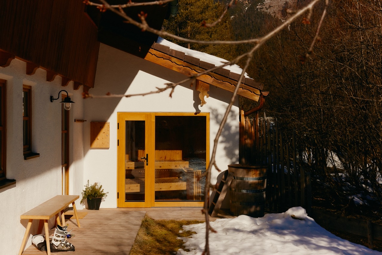 Sunlit exterior with warm wood-framed doors — Dimension Six project concept